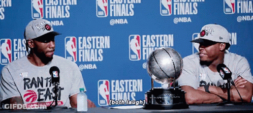 Two Basketball Players With Trophy GIF
