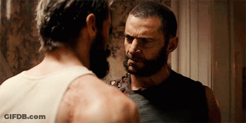 Two Bearded Men Looking At Each Other GIF