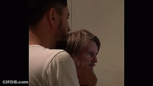 Two Bearded Men Standing In Room GIF