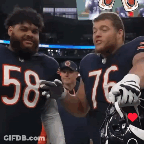 Two Bears Football Players Number 58 And 76 Are Hugging Each Other GIF