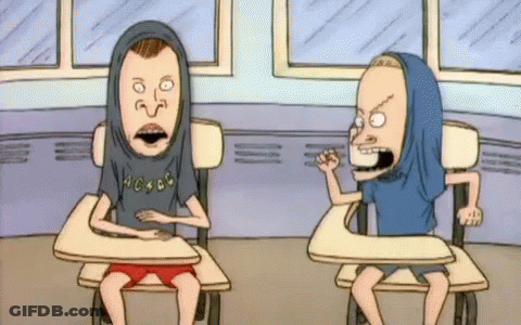 Two Beavis And Butthead Cartoon Characters Are Sitting At Desks GIF