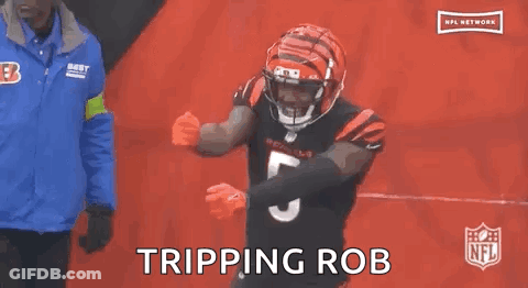 Two Bengals Football Players Hudson And 87 Are Hugging Each Other During A Game . GIF