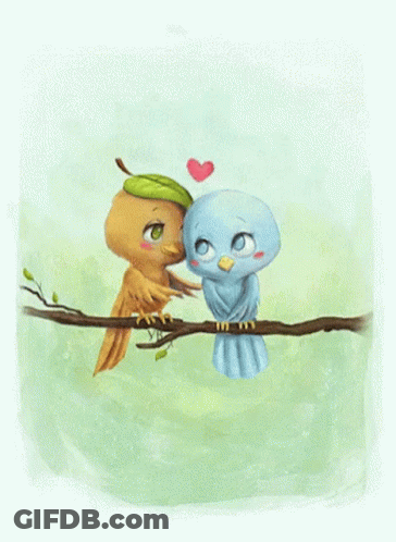 Two Birds Kissing On A Tree Branch With A Heart In The Background GIF