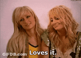 Two Blonde Women Are Standing Next To Each Other And One Of Them Is Saying Loves It GIF