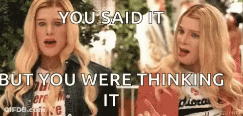 Two Blonde Women Are Standing Next To Each Other And Talking . GIF