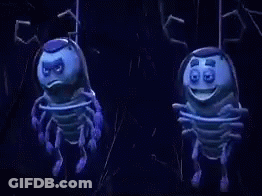Two Blue Cartoon Bugs Are Hanging From A Rope In The Dark . GIF