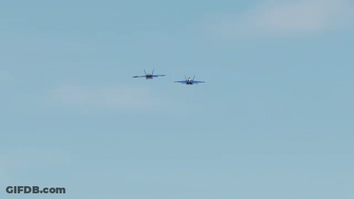 Two Blue Jets Flying In A Blue Sky GIF