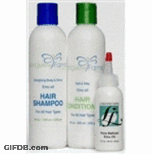 Two Bottles Of Hair Shampoo And Conditioner Are Sitting Next To Each Other GIF