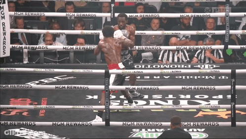 Two Boxers Are Fighting In A Boxing Ring With Mgm Rewards Written On The Ropes GIF