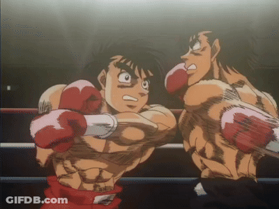 Two Boxers Are Fighting In A Ring And One Is Wearing Pink Gloves GIF