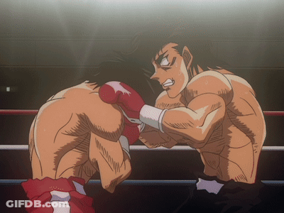 Two Boxers Are Fighting In A Ring And One Is Wearing Red Boxing Gloves GIF