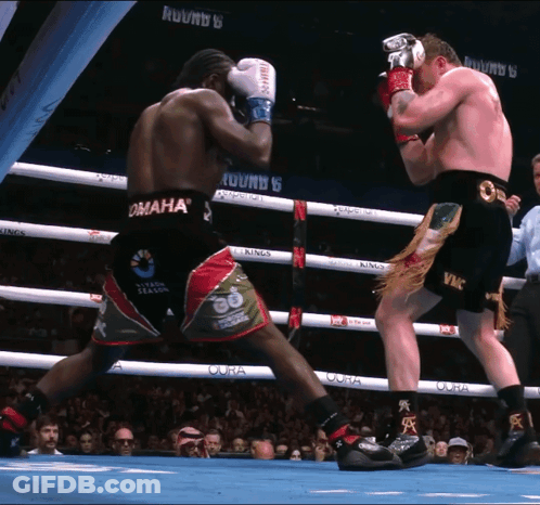 Two Boxers Are Fighting In A Ring That Says Omaha On It GIF