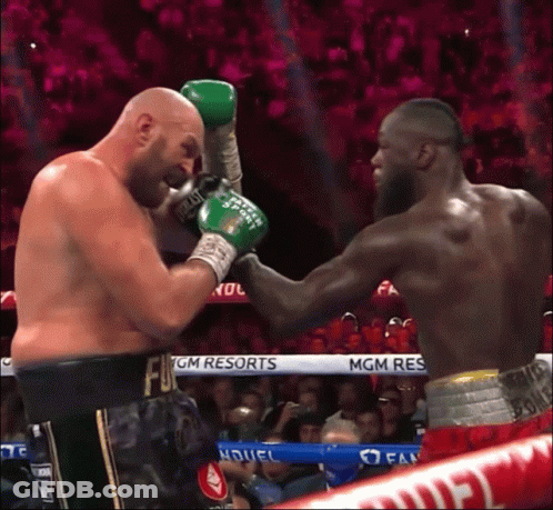 Two Boxers Are Fighting In A Ring With Mgm Resorts Written On The Ropes GIF