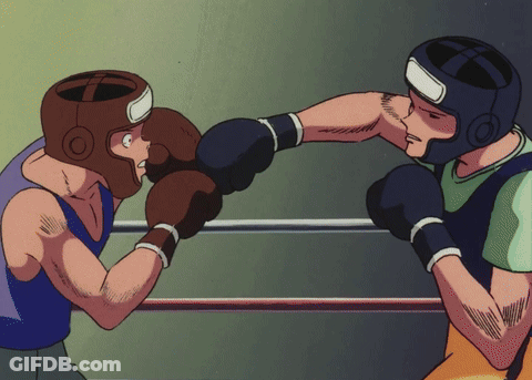 Two Boxers Are Fighting In A Ring With One Wearing A Helmet With The Letter O On It GIF
