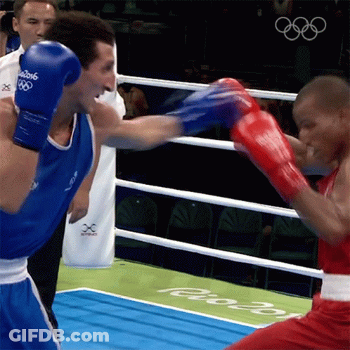 Two Boxers Are Fighting In A Ring With The Year 2016 On The Ground GIF