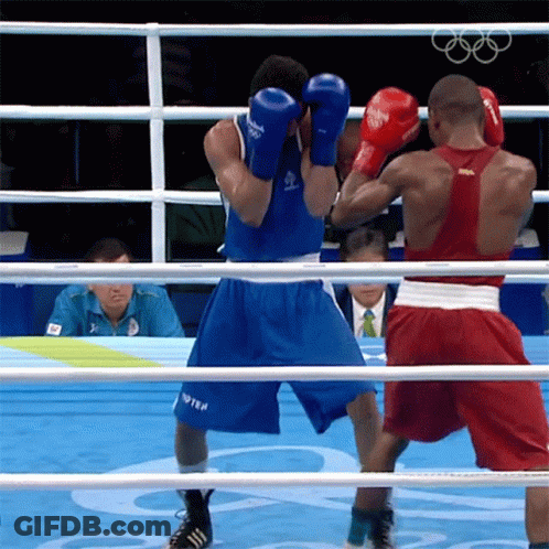 Two Boxers Are In A Ring With One Wearing A Shirt That Says ' Russia ' On It GIF