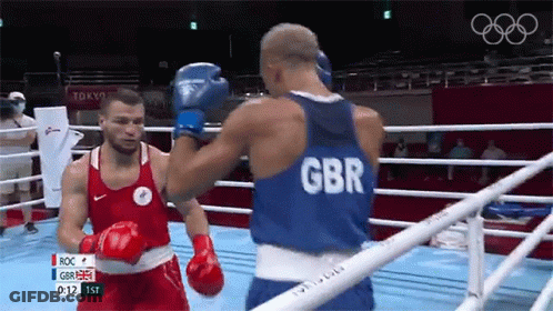 Two Boxers Fighting In Ring One Wearing GBR Shirt GIF