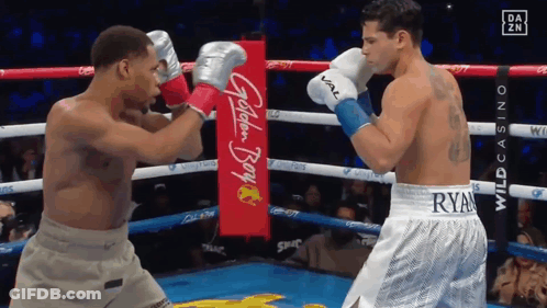 Two Boxers Fighting In Ring With Golden Boy Banner GIF