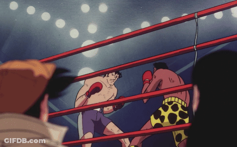 Two Boxers Fighting In Ring With Number 11 On Shorts GIF