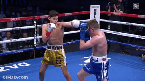 Two Boxers Fighting In Ring With OG Shorts GIF
