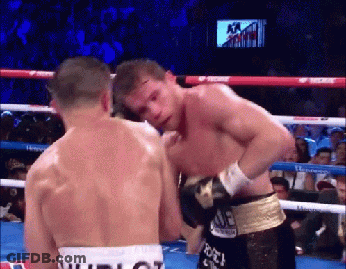 Two Boxers In A Boxing Ring With One Wearing A Belt That Says Tecate On It GIF