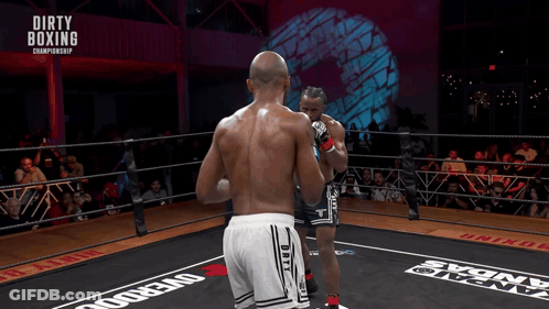 Two Boxers In A Boxing Ring With The Words Dirty Boxing Championship Above Them GIF
