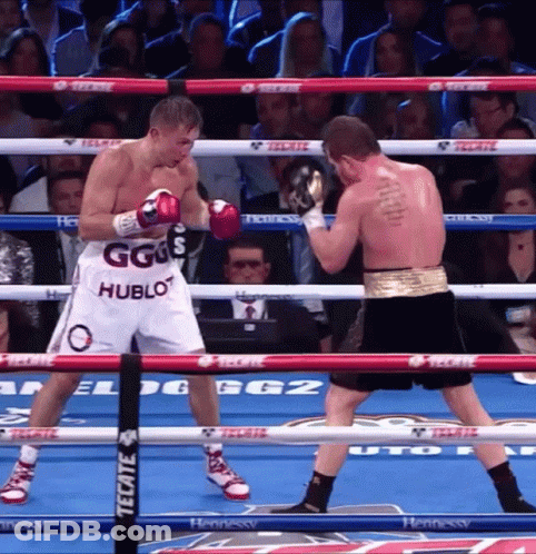 Two Boxers In A Ring With One Wearing Shorts That Say Ggs Hublot GIF