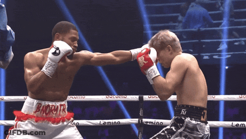 Two Boxers In Ring Shorts Saying Bnorytr GIF
