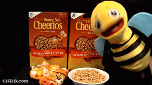 Two Boxes Of Honey Nut Cheerios Next To A Bee GIF