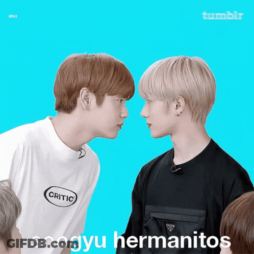 Two Boys Are Looking At Each Other With The Words Soogyu Hermanitos Written On The Bottom GIF