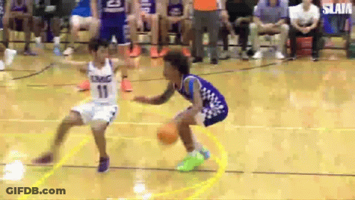 Two Boys Are Playing Basketball On A Court And One Is Wearing A Number 11 Jersey . GIF