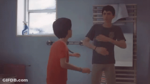 Two Boys Are Standing In A Room And One Of Them Is Saying " Yeah " GIF