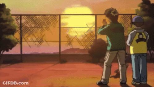 Two Boys Are Standing In Front Of A Fence And Watching The Sun Set GIF