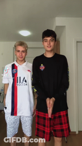 Two Boys Are Standing Next To Each Other And One Has A Shirt That Says ' Ia ' On It GIF