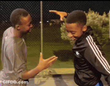 Two Boys Are Standing Next To Each Other And One Of Them Is Wearing A Black Adidas Jacket GIF