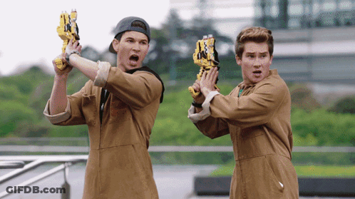 Two Boys Holding Guns One Wearing Hat GIF