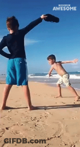 Two Boys Playing On Beach With Awesome GIF