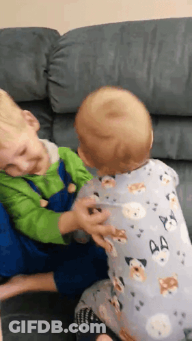 Two Boys Playing On Couch GIF