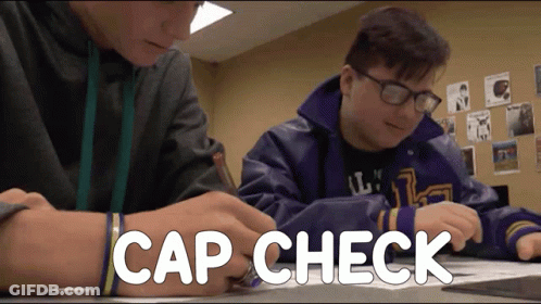 Two Boys Sitting At Desk With Cap Check GIF