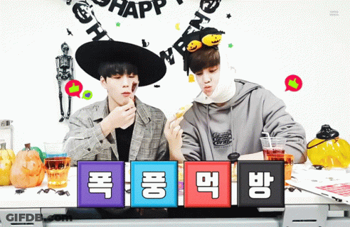 Two Boys Sitting At Halloween Party GIF