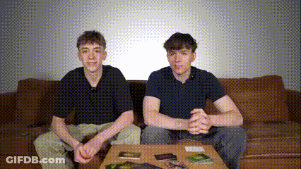 Two Boys Sitting On Couch With Table GIF