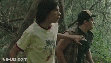 Two Boys Standing In A Forest GIF