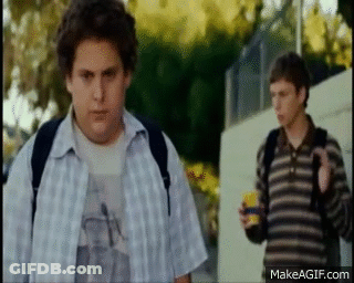 Two Boys Standing On Sidewalk GIF