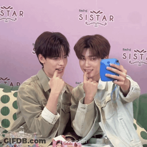 Two Boys Taking Selfie In Front Of Sistar Wall GIF