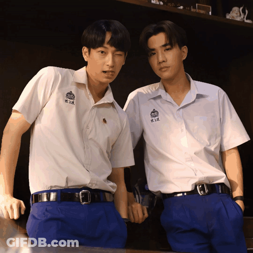 Two Boys Wearing White Shirts With H.i.k. On The Front GIF