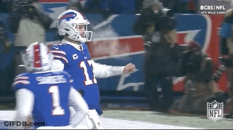 Two Buffalo Bills Players Are Celebrating A Touchdown During A Football Game . GIF