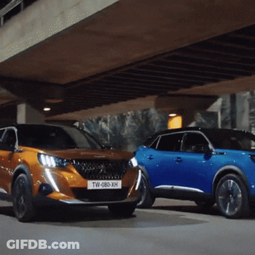 Two Cars Are Parked Next To Each Other And One Has A License Plate That Says Tw-088-Xh GIF
