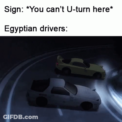 Two Cars Driving Down Road Sign You Can't U-Turn Here Egyptian Drivers GIF