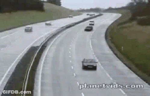 Two Cars Driving On Highway GIF
