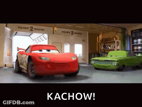 Two Cars In A Garage With The Words Kachow On The Bottom Right GIF